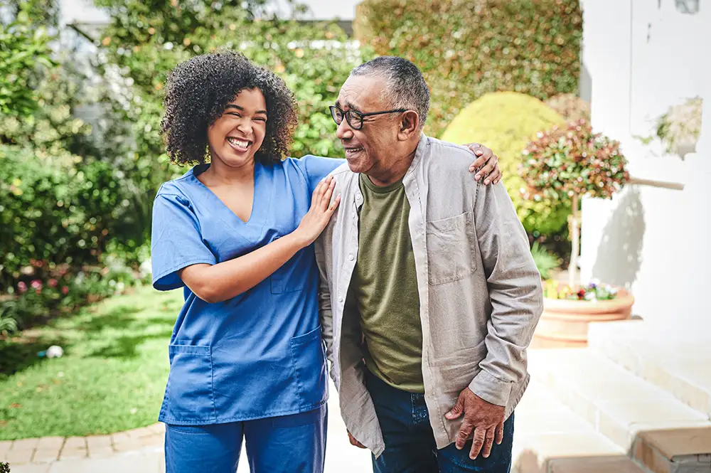 assisted living resident with caregiver
